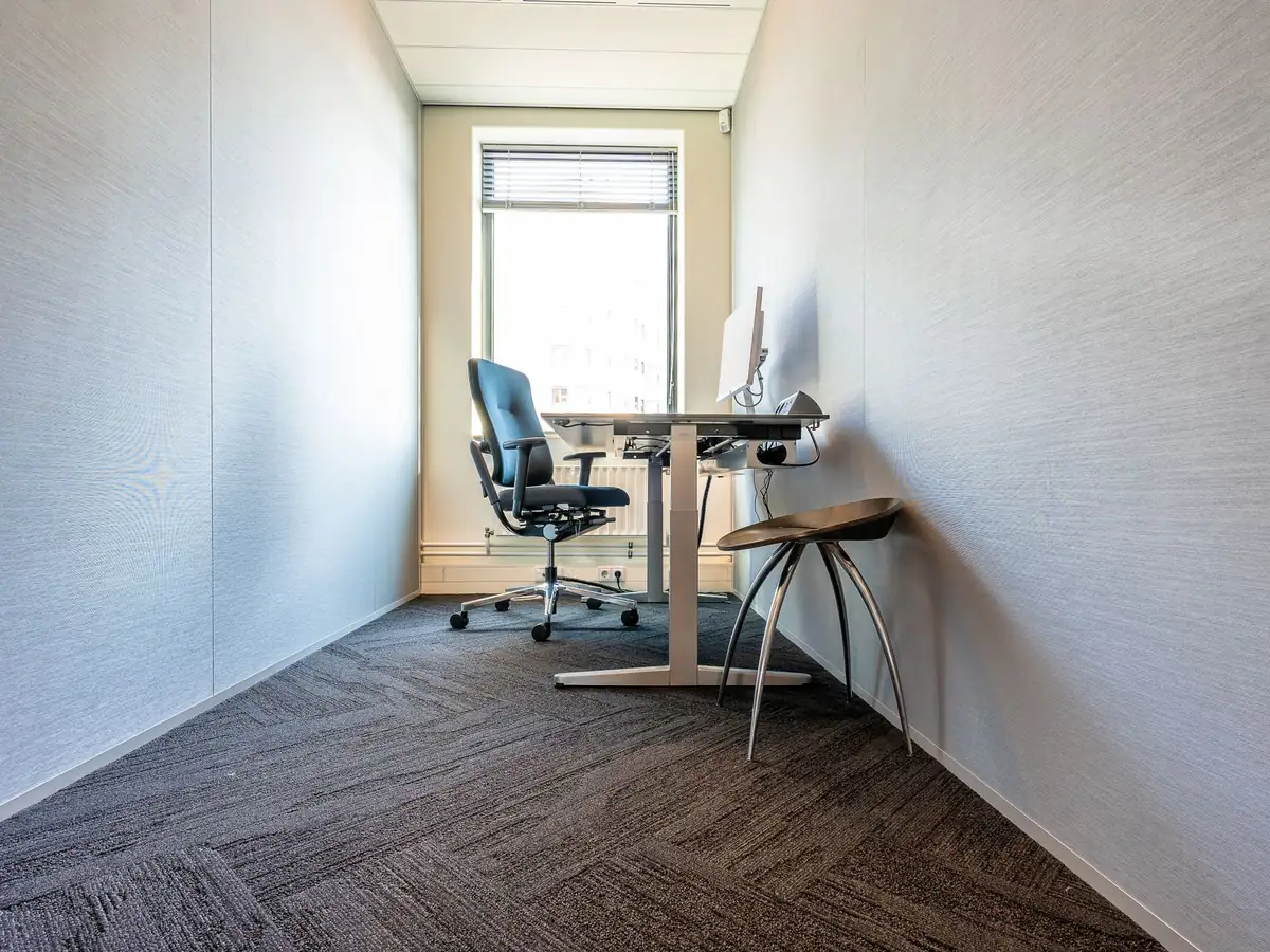 Small office with one desk, a chair and a window